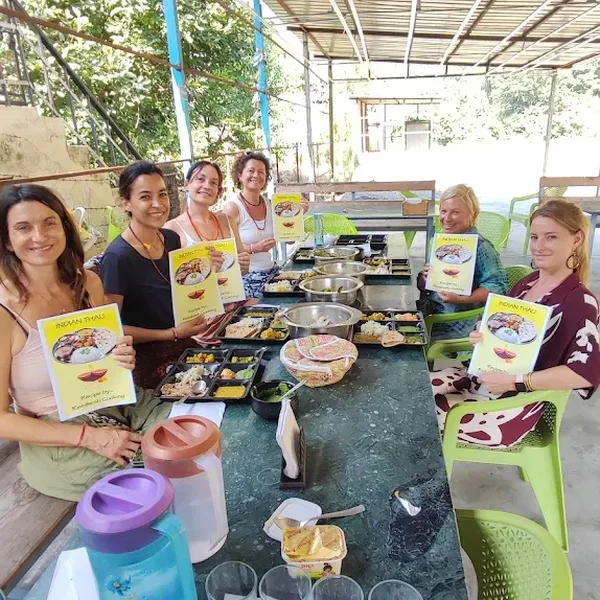 International guests enjoying hands-on cooking class in Rishikesh
